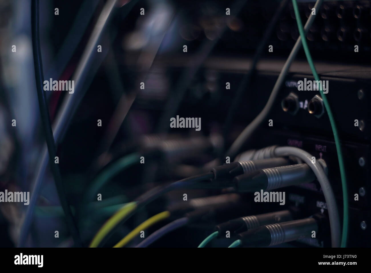 Recording studio gears in rack. Audio cables and connectors in studio