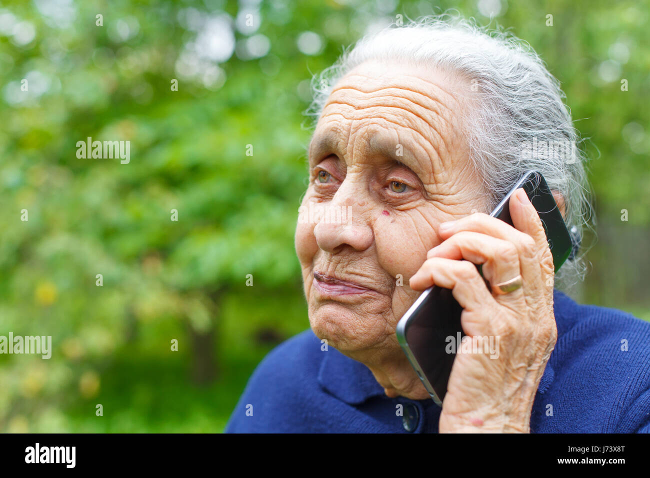 Picture of a happy old woman, talking on cell phone Stock Photo - Alamy