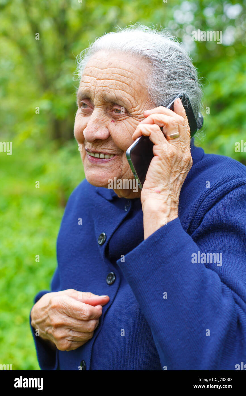 Picture of a happy senior woman talking on cell phone Stock Photo - Alamy