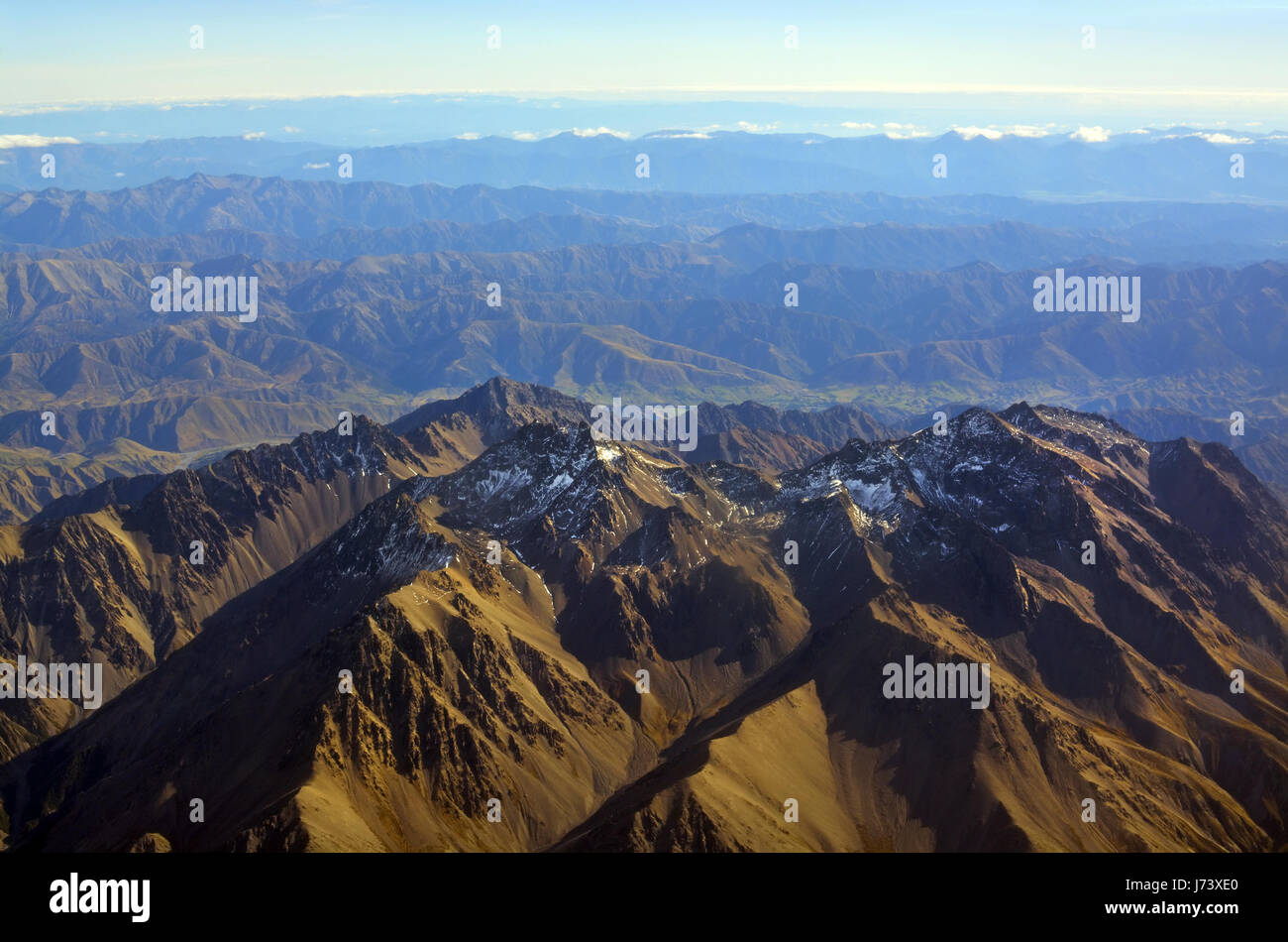 Aerial view of the Seaward Kaikoura Mountains on an Autumn morning. In the background is the Conway River, & New Zealand Southern Alps. Stock Photo