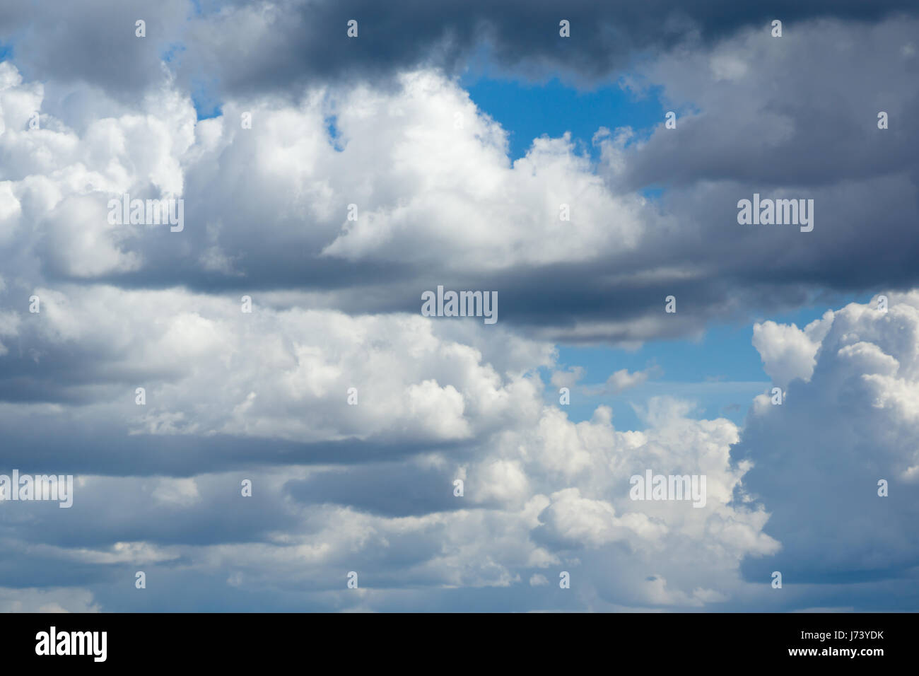 Blue sky with lots of white clouds Stock Photo - Alamy