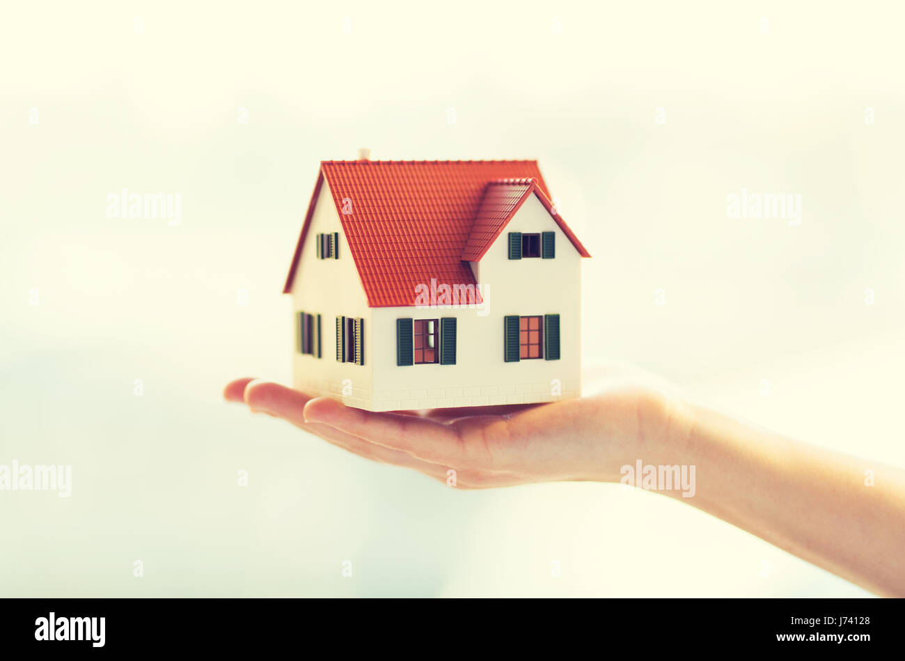close up of hands holding house or home model Stock Photo - Alamy
