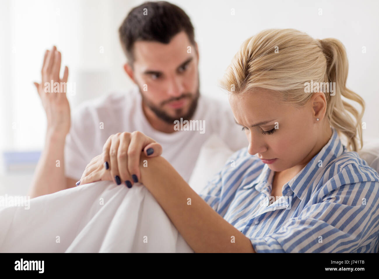 unhappy couple having conflict in bed at home Stock Photo - Alamy
