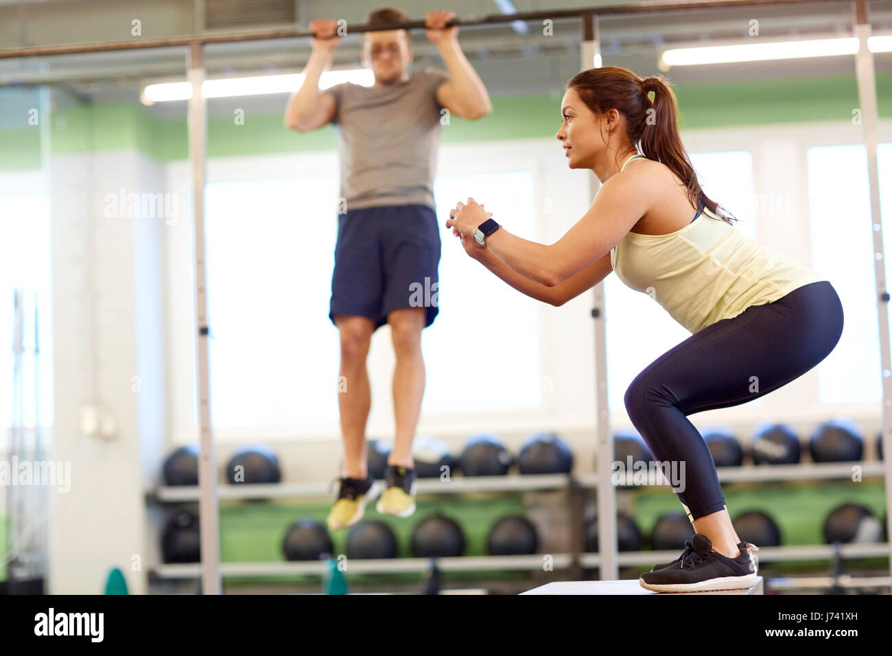 woman and man exercising in gym Stock Photo - Alamy