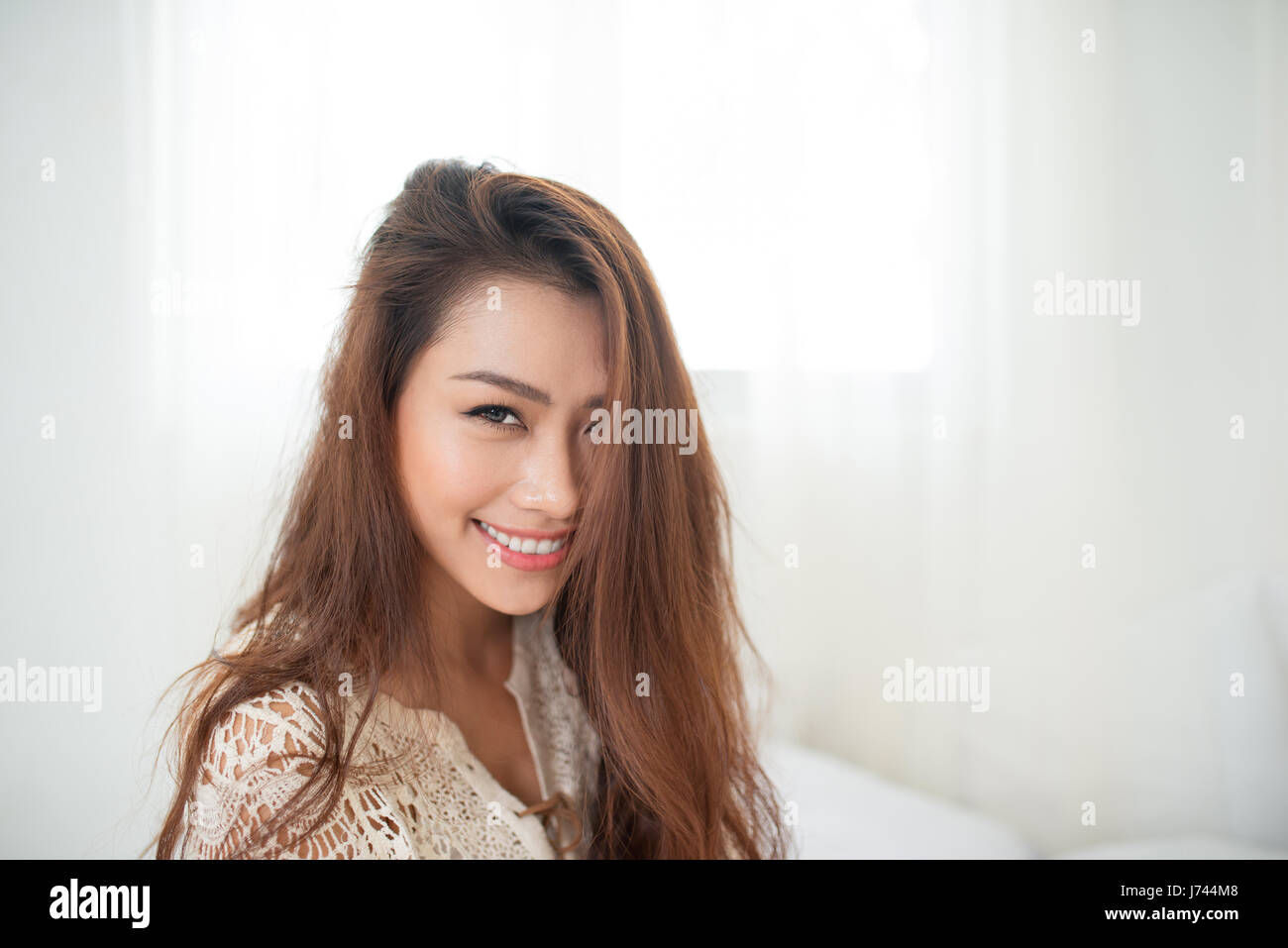 Woman Relaxing in bed and relaxing in her living room Stock Photo - Alamy