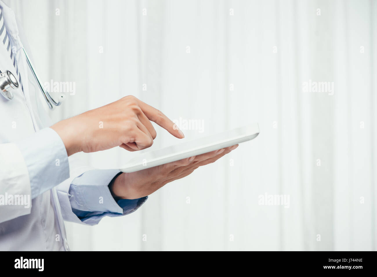 Close-shot of male doctor using a digital tablet Stock Photo