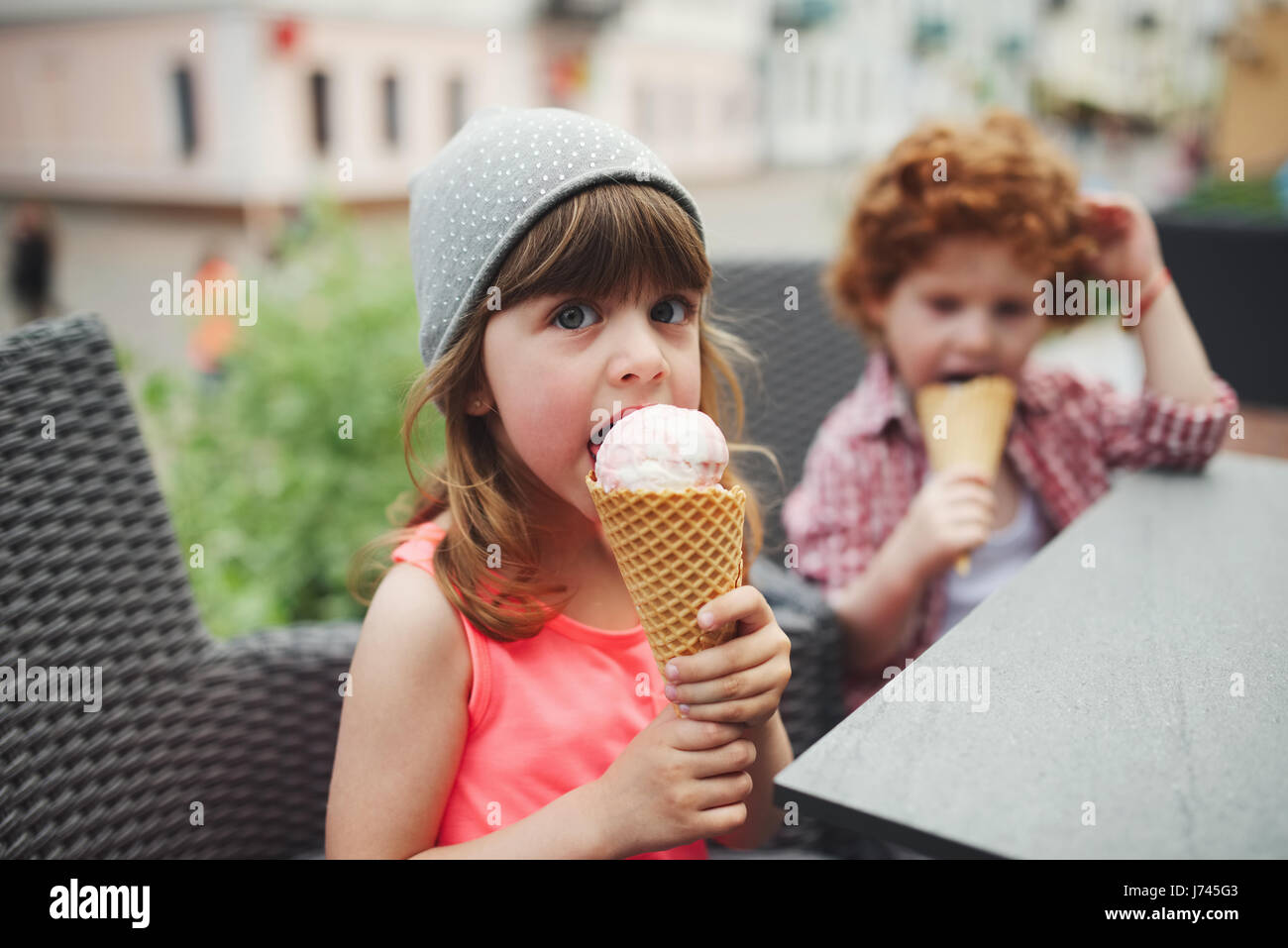 two cute hipsters eating icecream Stock Photo