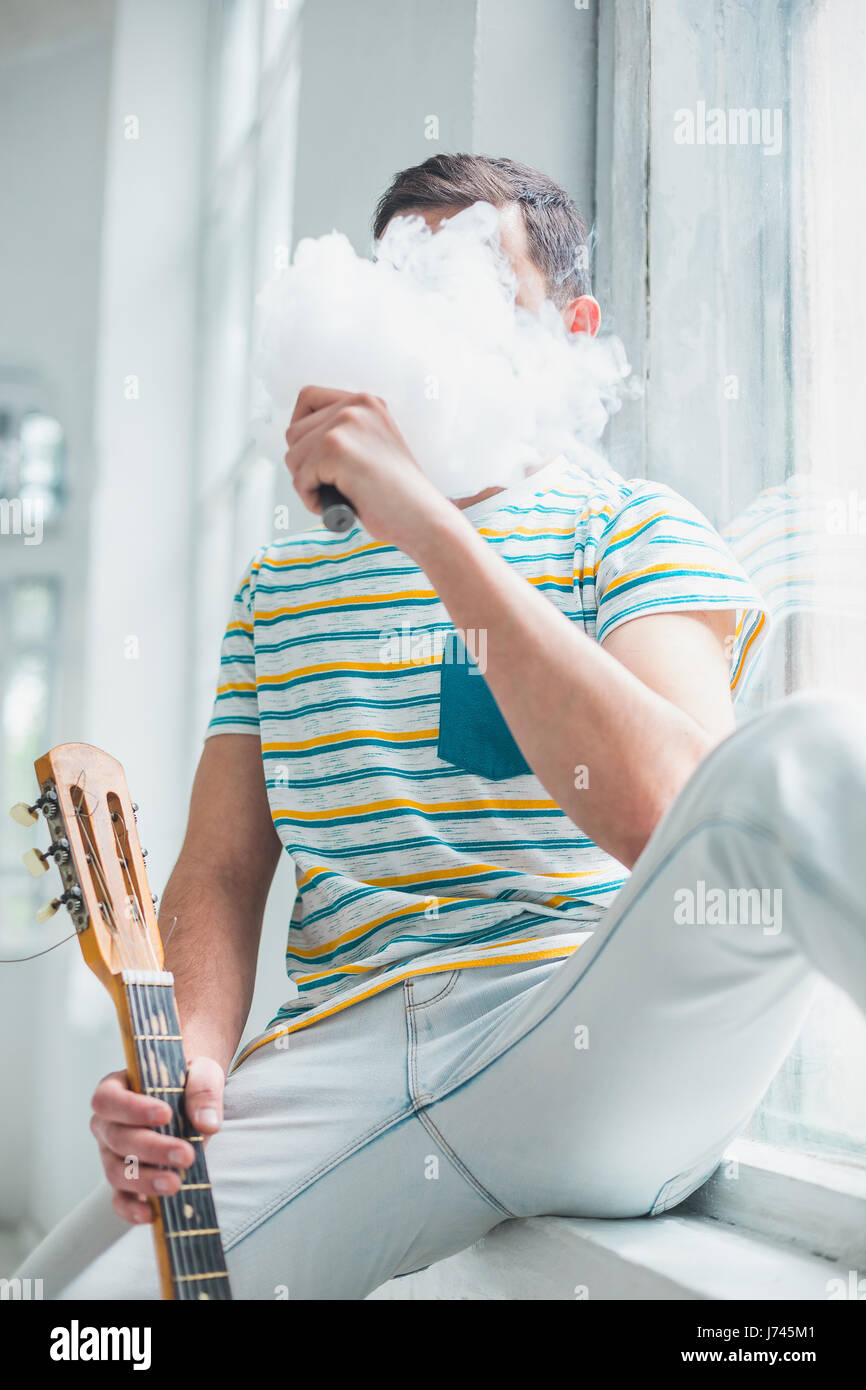 The face of vaping young man Stock Photo