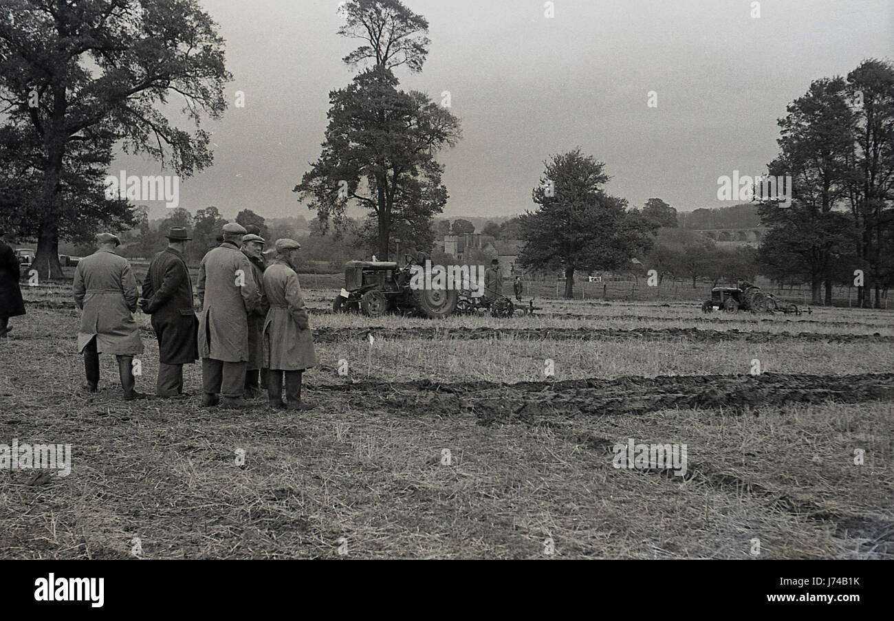 1950s, Judges watch the competitors in a ploghing contest, England, UK. Stock Photo