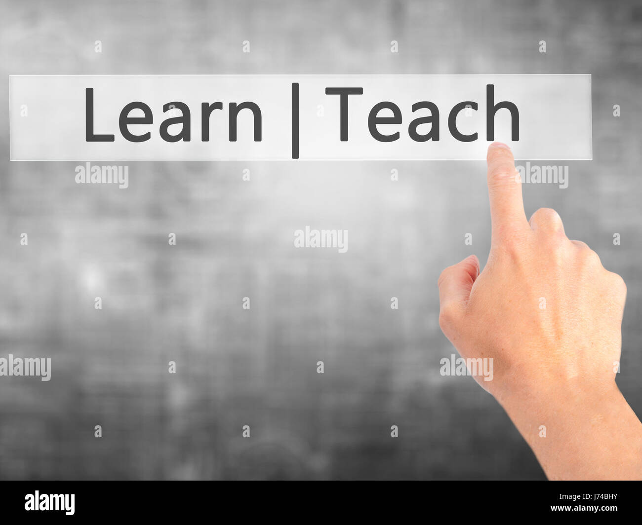 Learn Teach - Hand pressing a button on blurred background concept ...