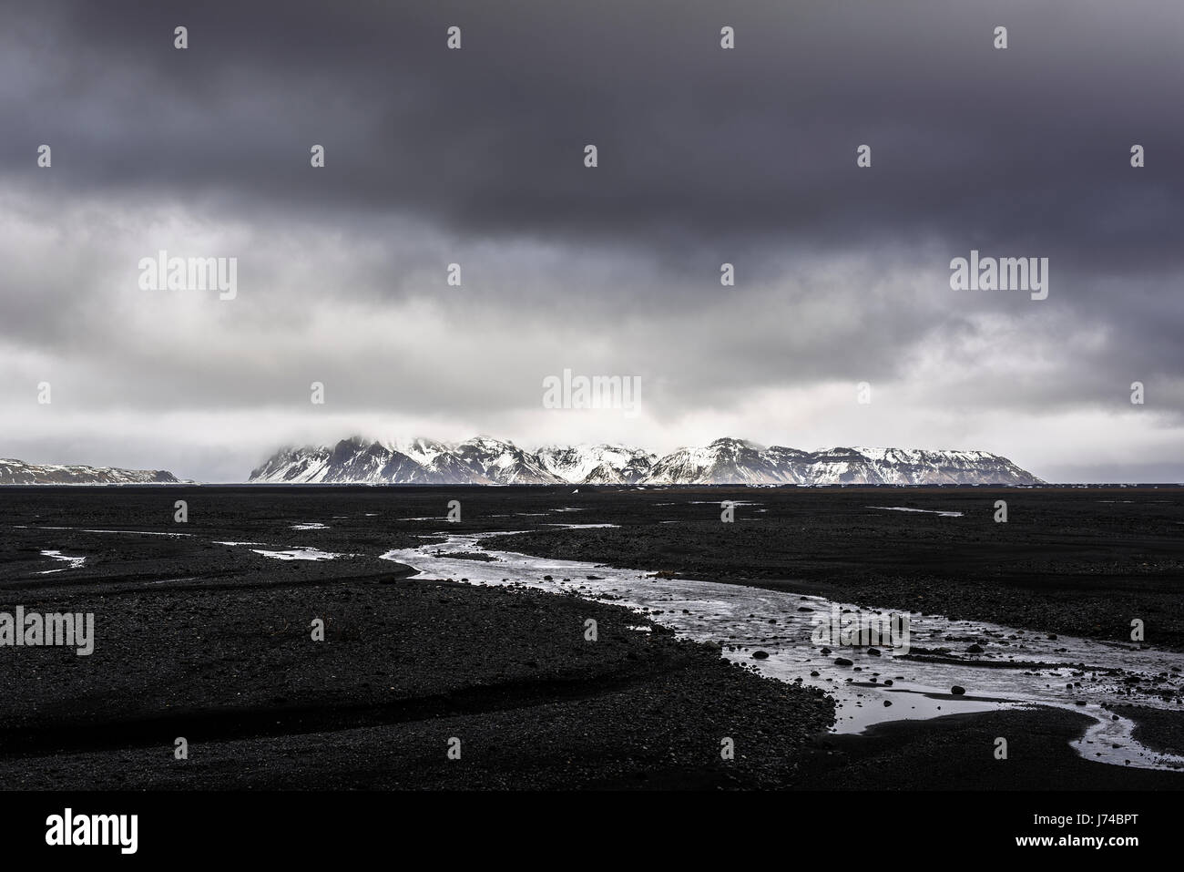 Dark landscape from the Myrdalssandur road on a rainy day. Stock Photo
