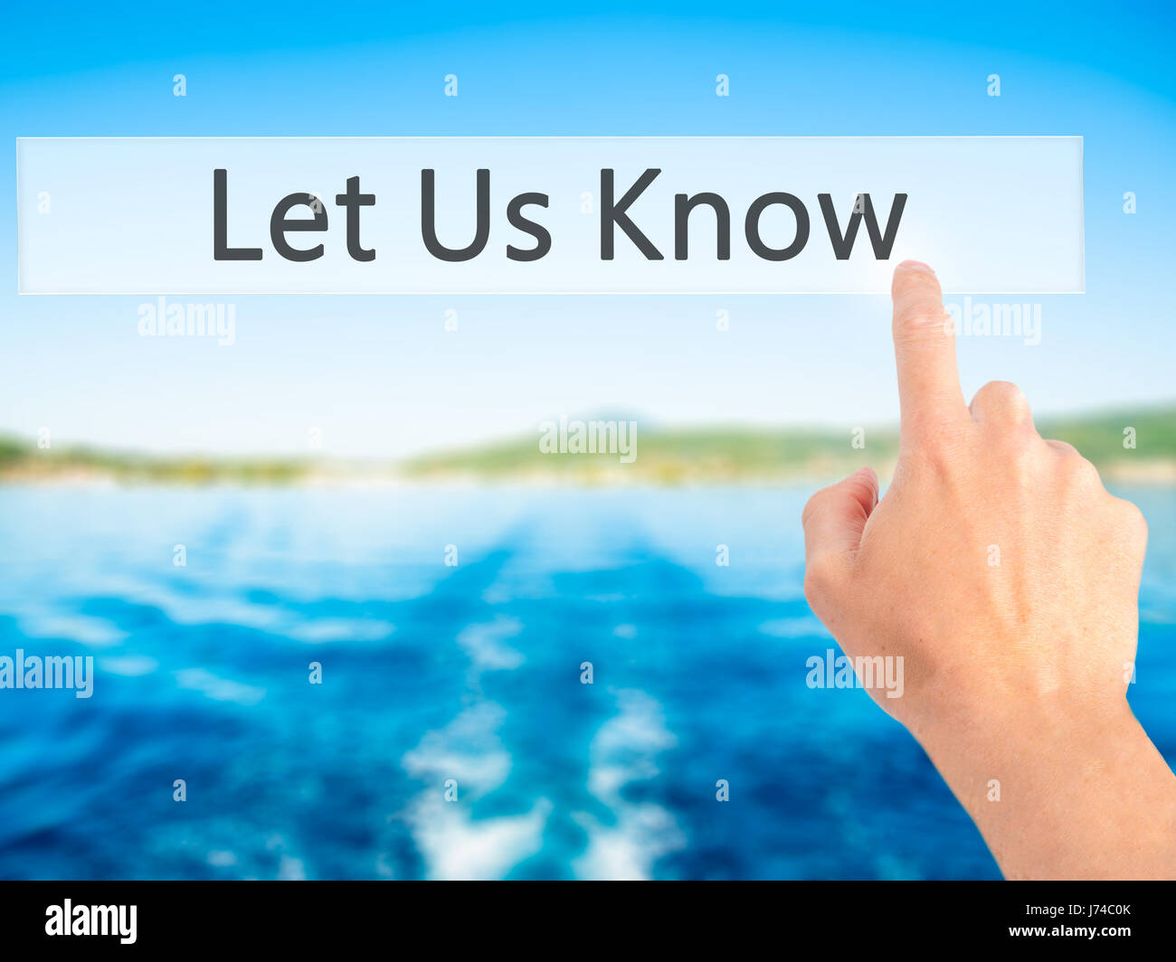 Let Us Know - Hand pressing a button on blurred background concept ...