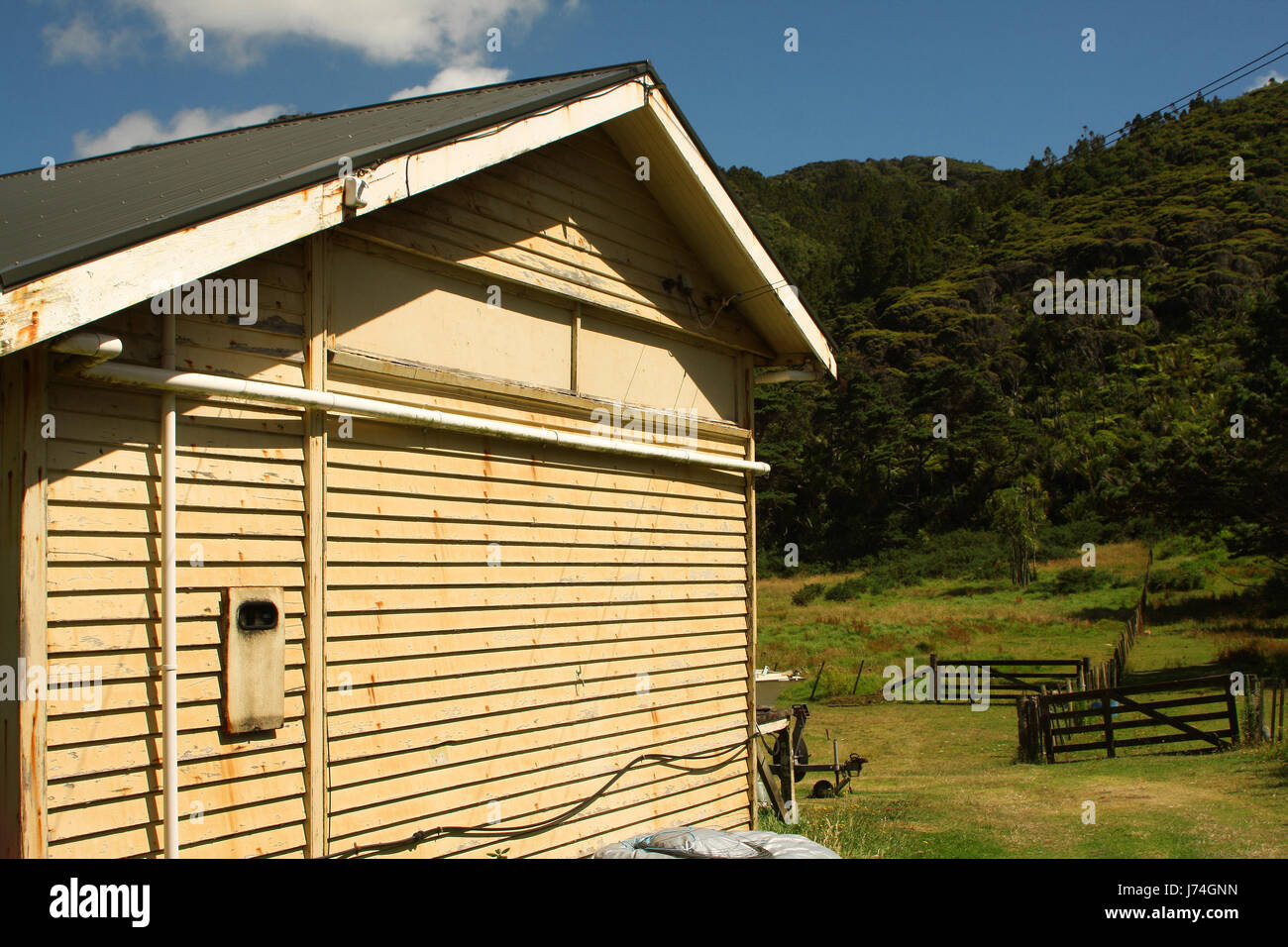 bucolic agriculture farming hovel fence meadow lodge forest hut willow bucolic Stock Photo