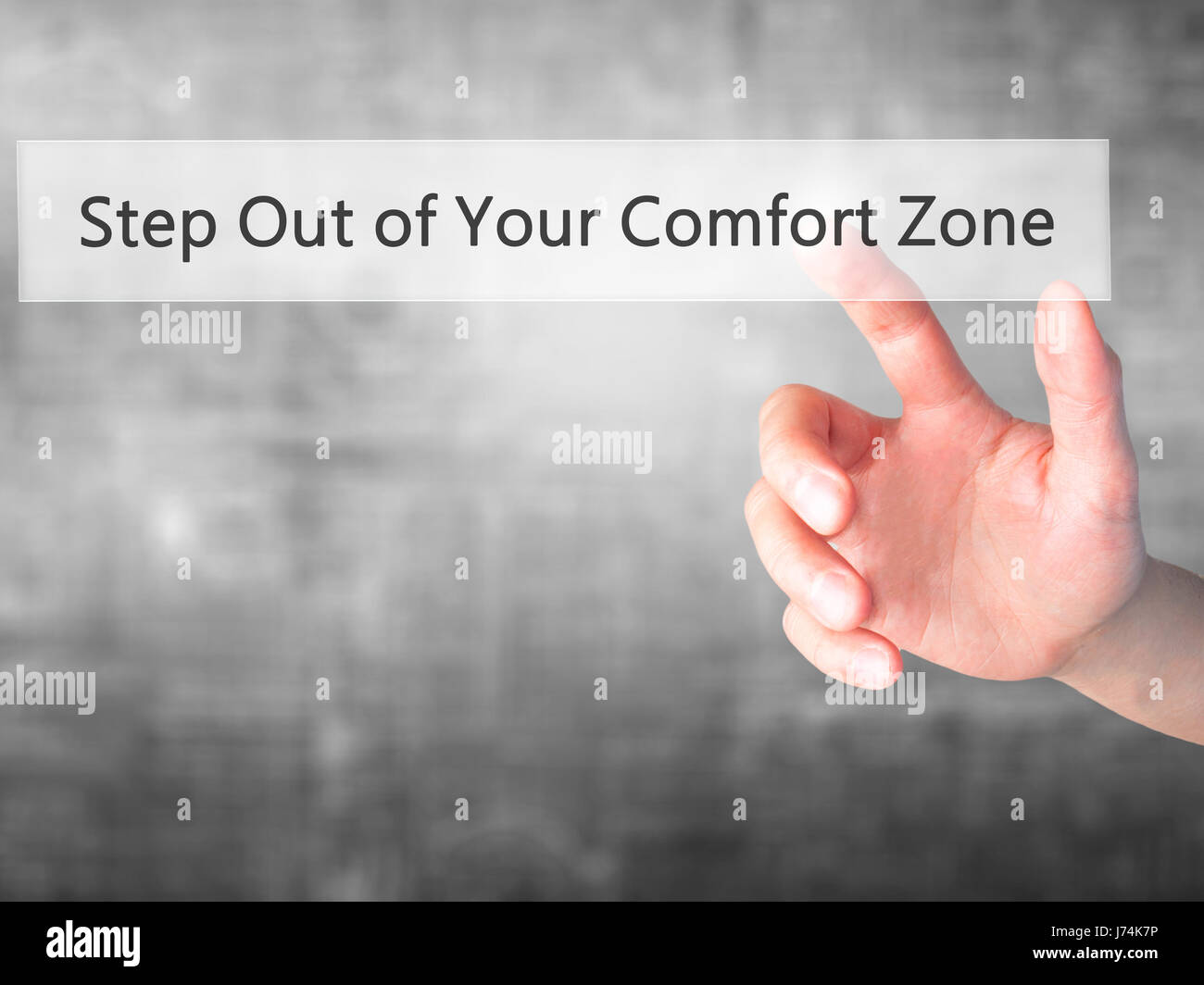 Step Out of Your Comfort Zone - Hand pressing a button on blurred background concept . Business, technology, internet concept. Stock Photo Stock Photo