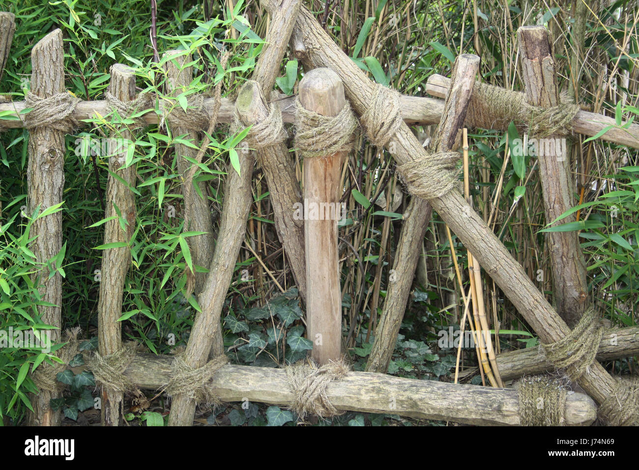 natural fence tied with rope Stock Photo Alamy