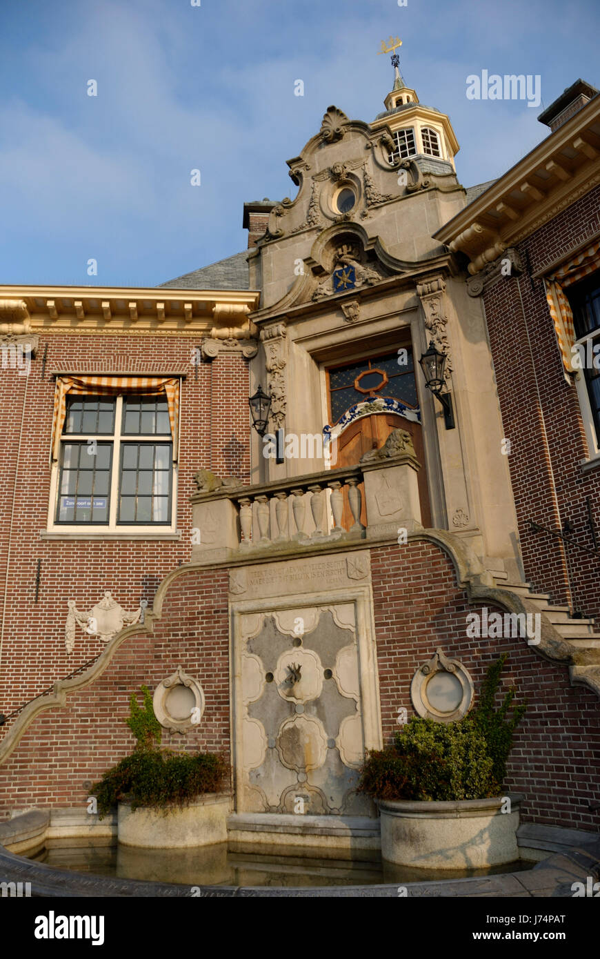 holland town hall facade blue house building window porthole dormer