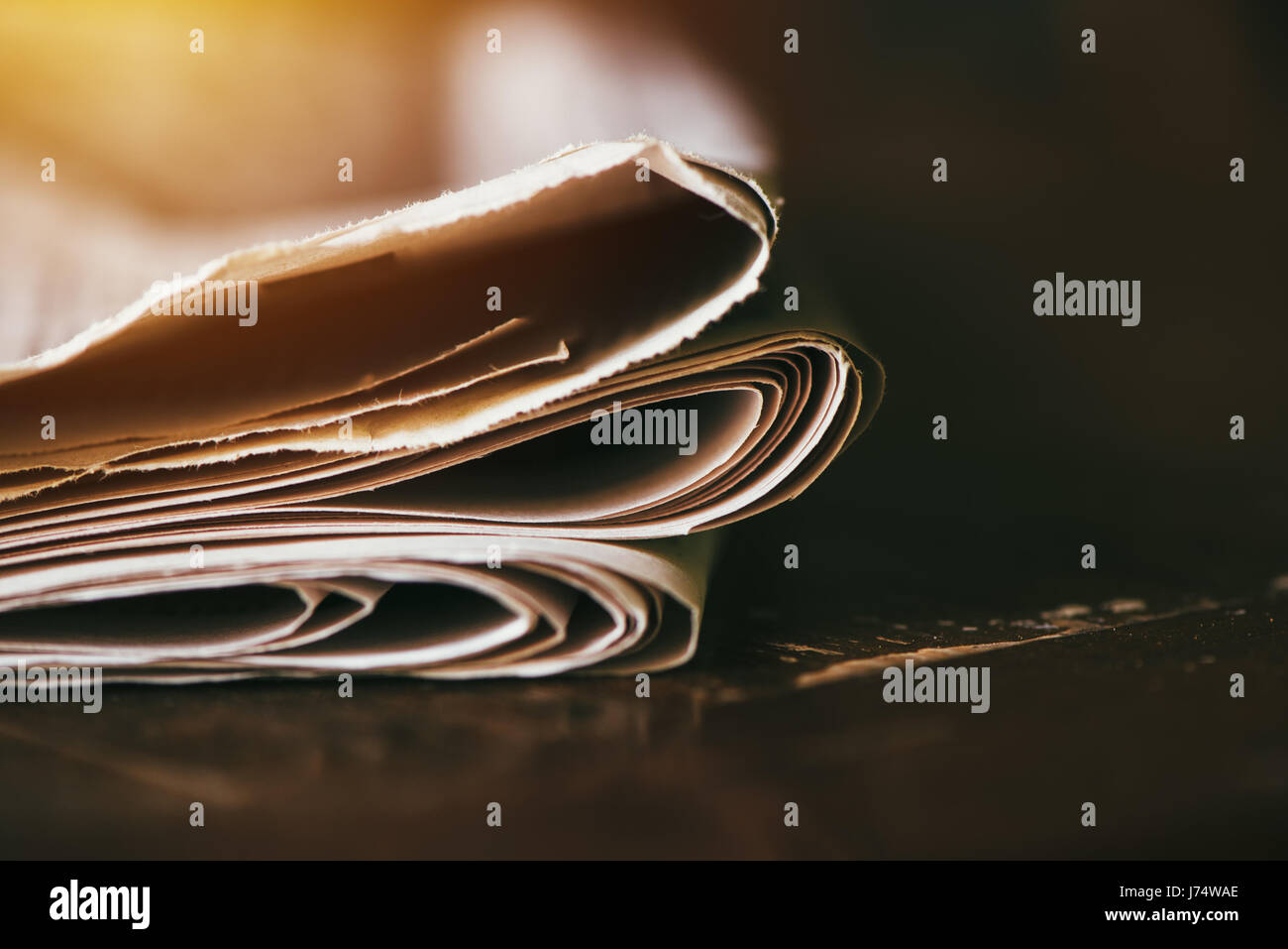 Folded newspaper close up, daily paper on the table Stock Photo