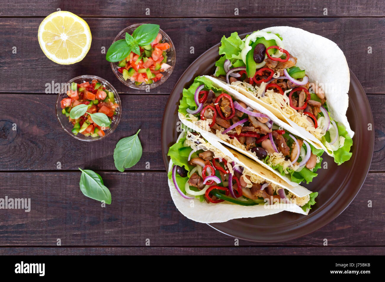 Tacos is a traditional Mexican dish. Tortilla stuffed with chicken