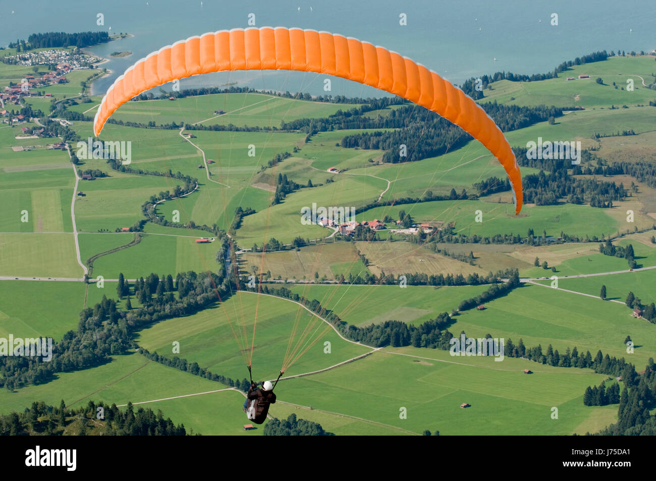 paraglider over the schwangau Stock Photo