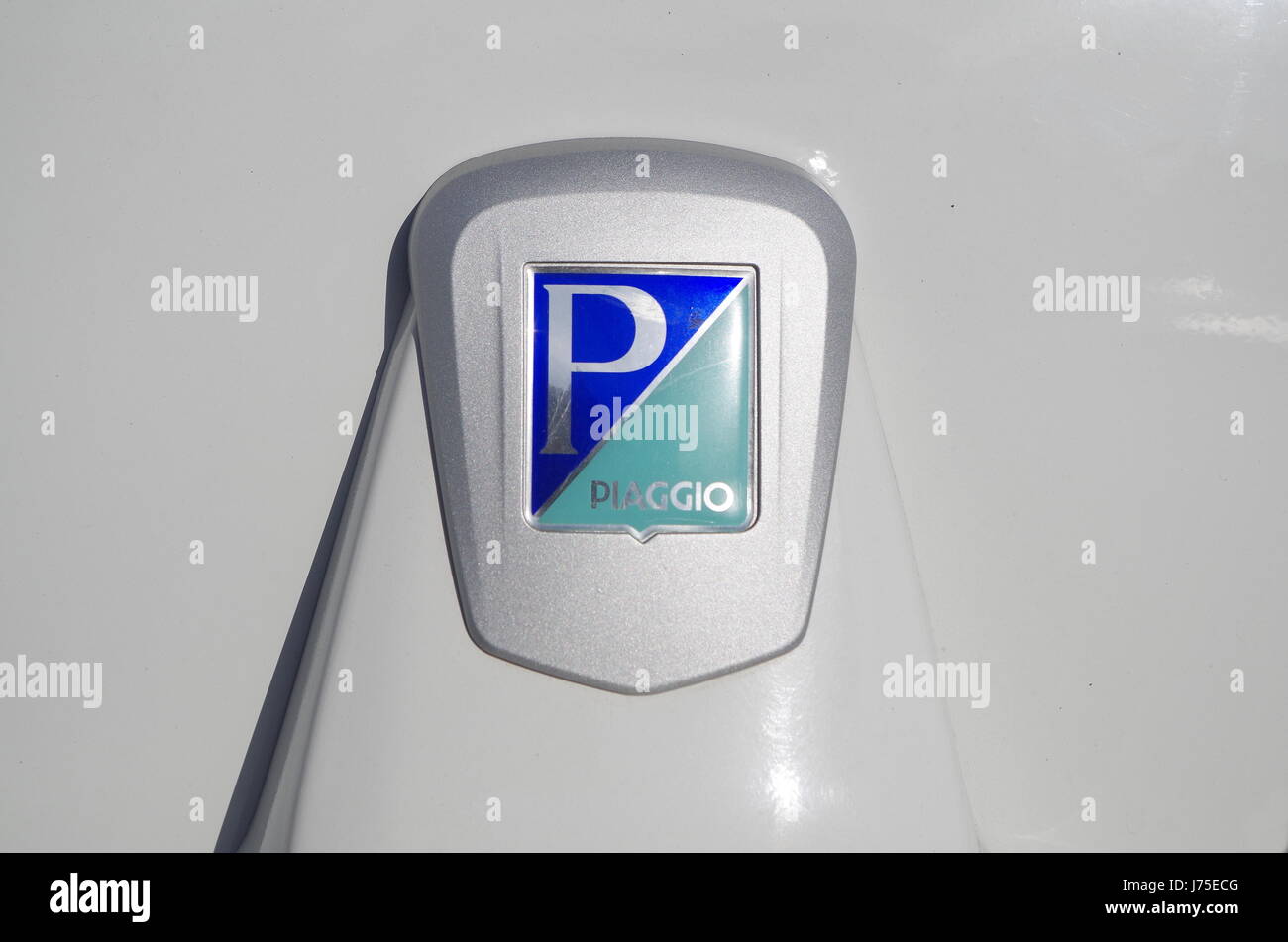 Piaggio logo detail from a white Tuk-tuk, model: Ape Calissimo 200. Popular way of tranportation in travel destinations among Asia and Stock Photo