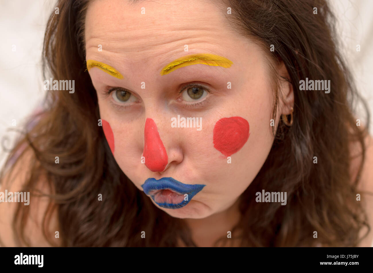 young woman with body painting on her face, ugly scary clown, Halloween  topic Stock Photo - Alamy