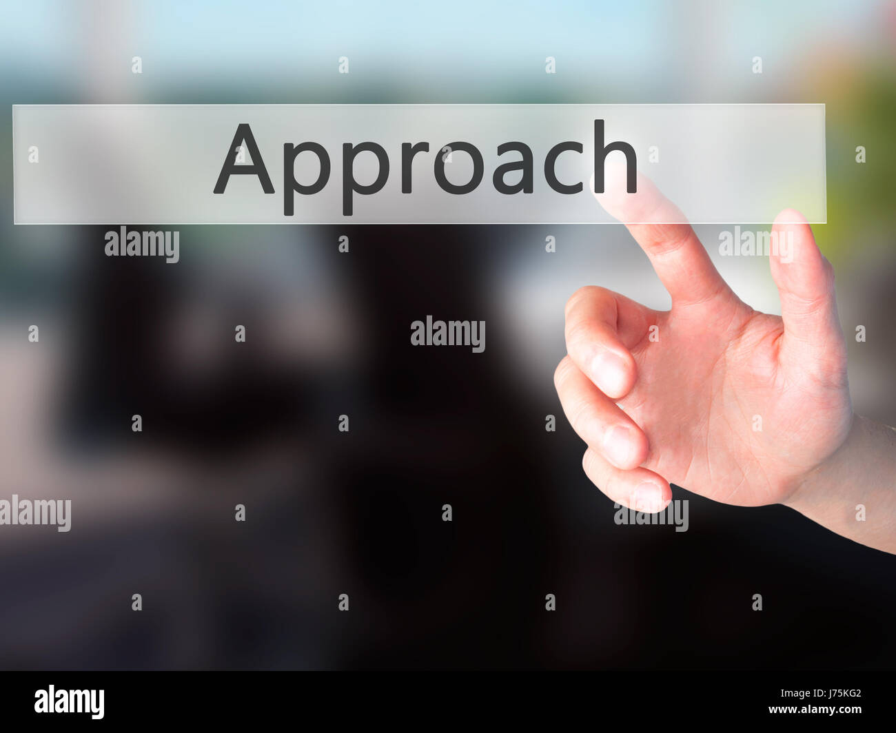 Approach - Hand pressing a button on blurred background concept ...