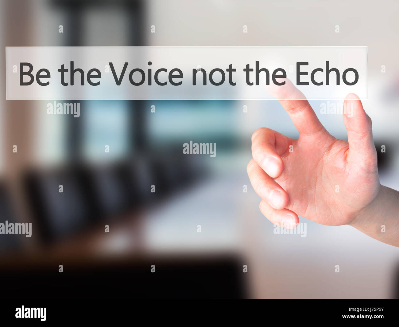 Be the Voice not the Echo Hand pressing a button on blurred background concept . Business