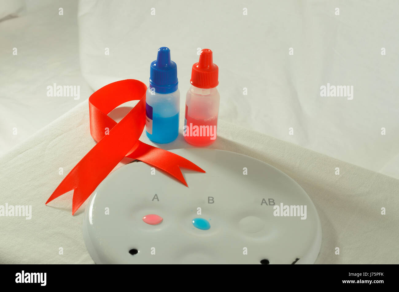 Red ribbon blood sample hi-res stock photography and images - Alamy