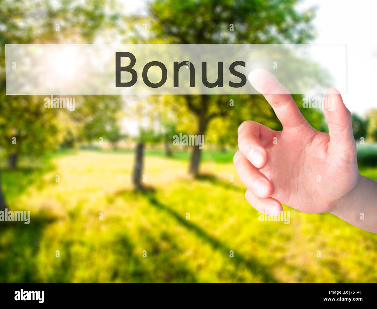 Bonus - Hand pressing a button on blurred background concept . Business, technology, internet concept. Stock Photo Stock Photo