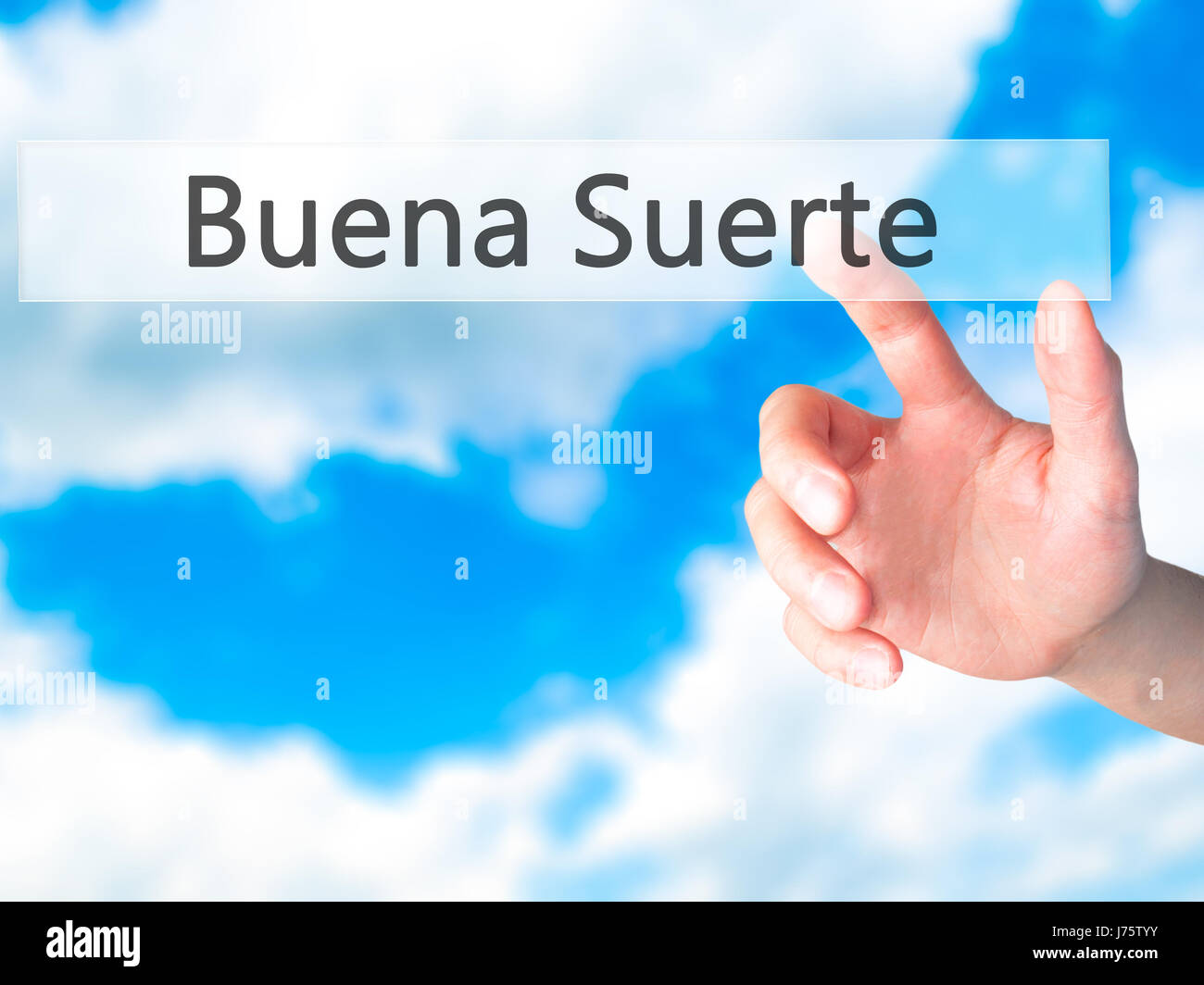Buena Suerte ( Good Luck in Spanish) Hand pressing a button on