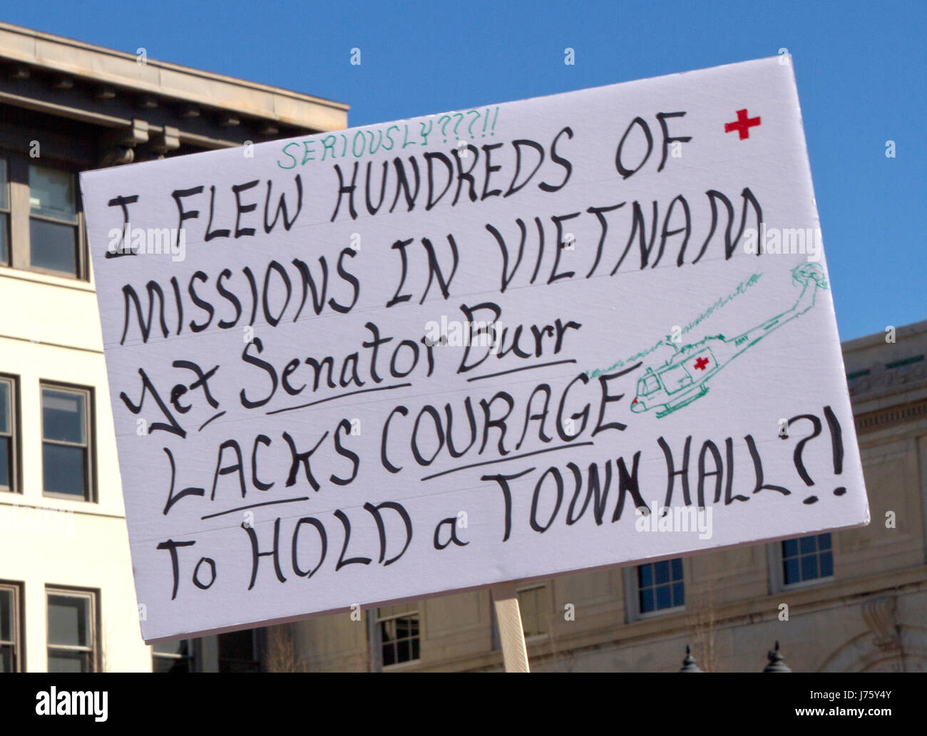 Asheville, North Carolina, USA - February 25, 2017:  North Carolina constituent holds a sign at an Affordable Care Act rally incredulously saying that Stock Photo