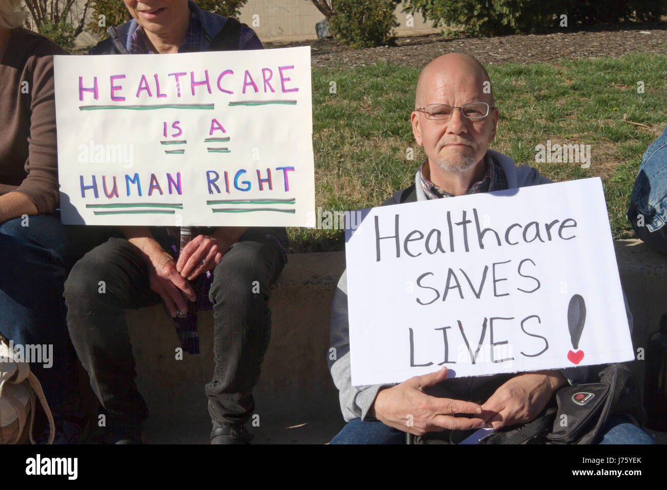 Asheville, North Carolina, USA - February 25, 2017:  Older Americans hold signs at an Affordable Care Act rally saying 'Healthcare is a Human Right' a Stock Photo