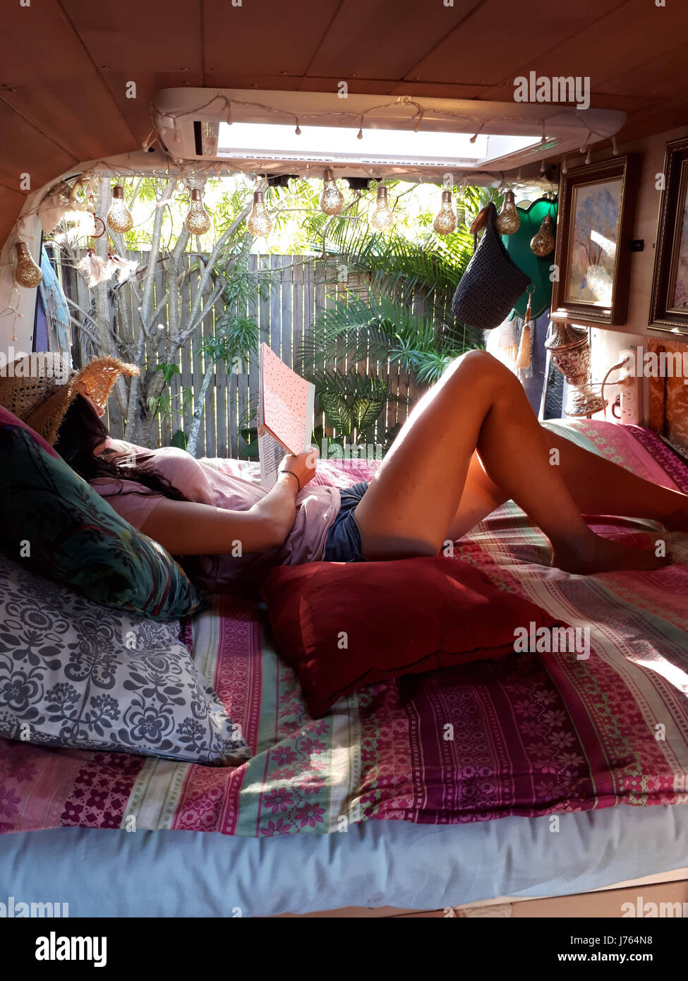 MEET the couple who sold both their businesses to travel the road and spent £8,500 transforming their Renault van into a glamper van called Lucy. The series of envy-inducing pictures and video show how Juliet (35) and Frank (39) from Melbourne, Australia spent three-months working on their rolling home which they are now living in as they travel around the country with their beloved pet dogs, Arnie and Wolly. Other images show the couple relaxing inside the stunning van, preparing dinner in their self-contained kitchen area and embracing the great outdoors by cooking a steak on an open fire. B Stock Photo
