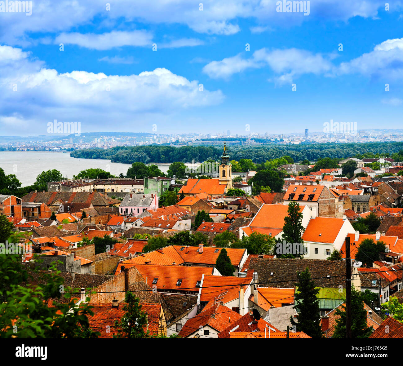 travel roofs shingles old belgrade row tower buildings houses church city town Stock Photo