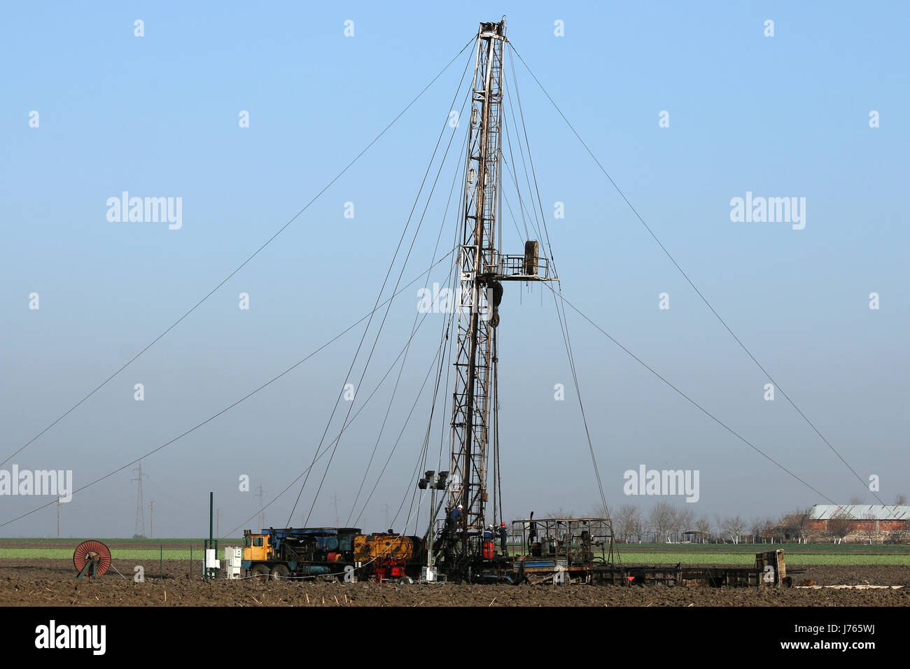 Drilling Rig In Rural oil workers with land drilling rig Stock Photo - Alamy