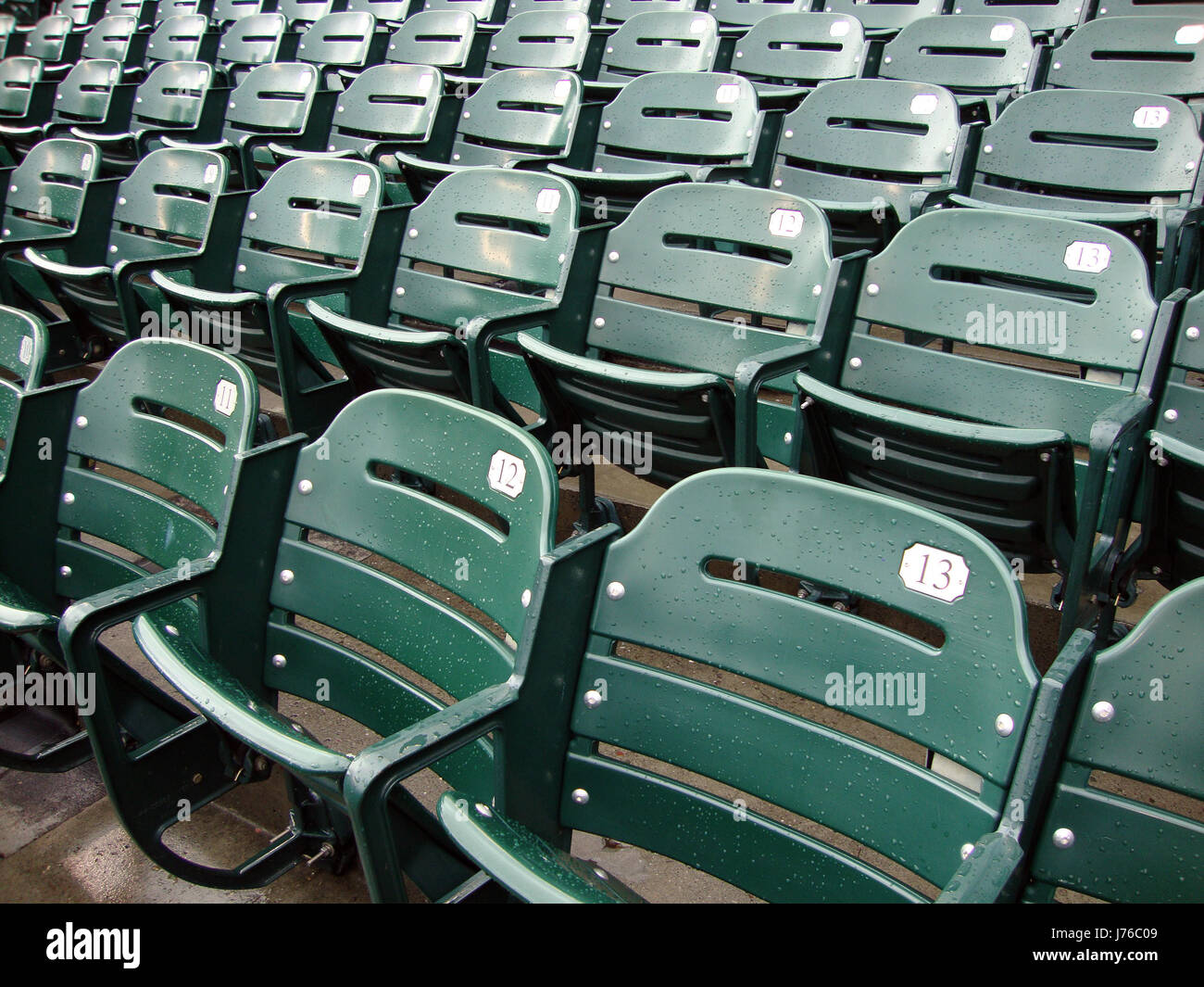outdoor wet stadium seats empty baseball ballpark design write wrote  writing Stock Photo - Alamy