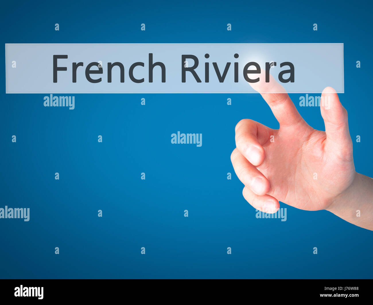 French Riviera - Hand pressing a button on blurred background concept . Business, technology, internet concept. Stock Photo Stock Photo