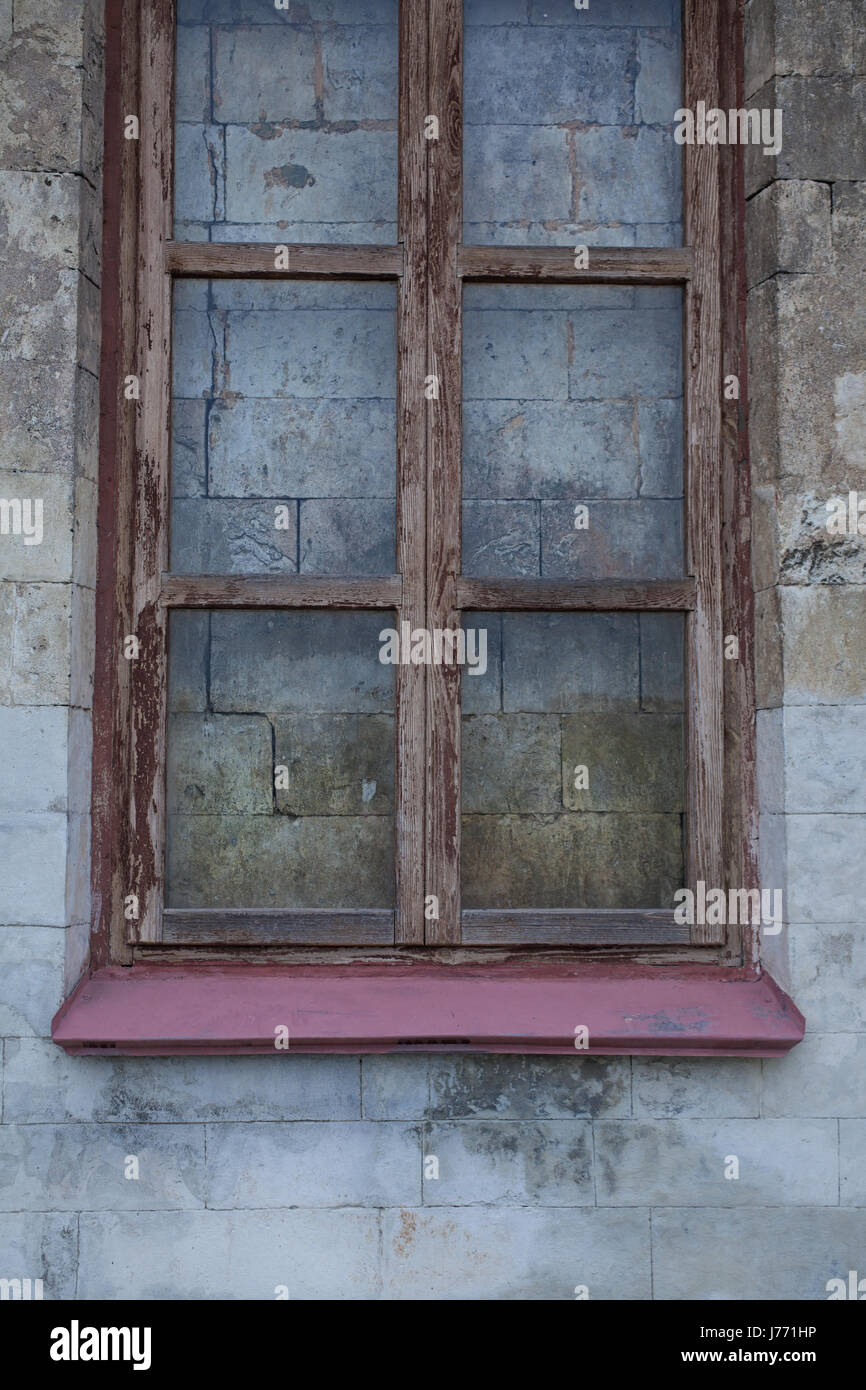 A window in the wall walled up with stones Stock Photo - Alamy