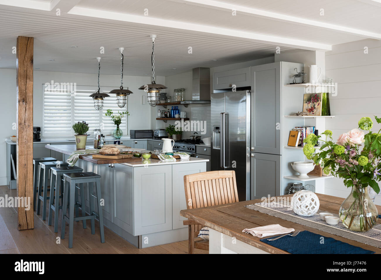 Reconditioned pendant lamps in bespoke Sylvarna kitchen Stock Photo