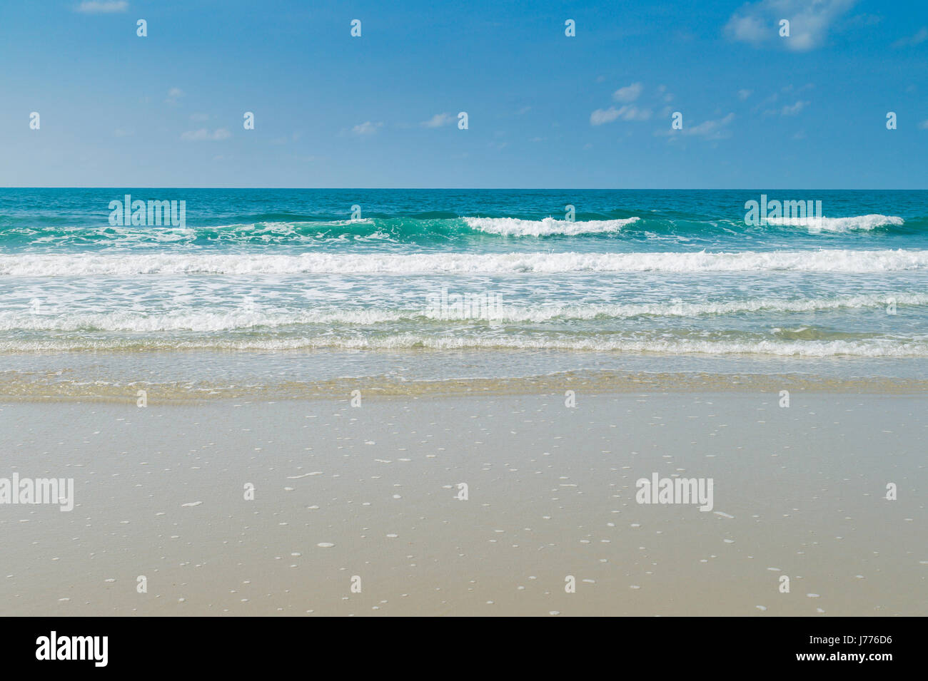 Tropical beach with clear water and blue sky Stock Photo - Alamy