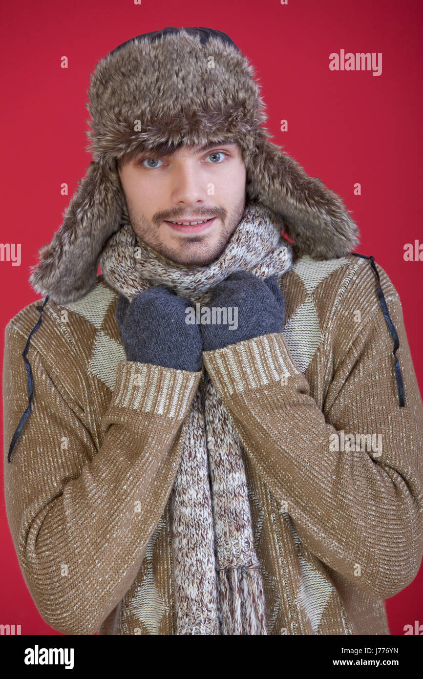 winter hat portrait fur studio sweater freezing man fashion winter male Stock Photo