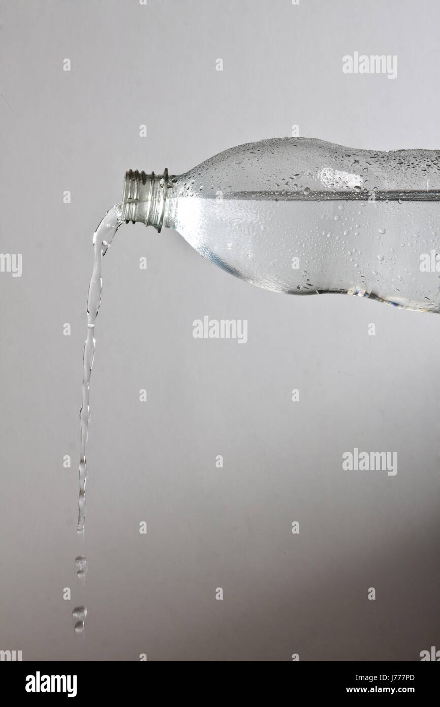 drink mineral water water drink counter-light bottle pour in mineral water Stock Photo