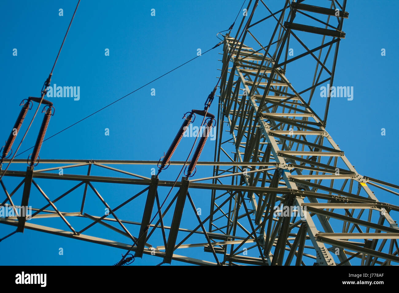 blue energy power electricity electric power mast current mast open wire Stock Photo