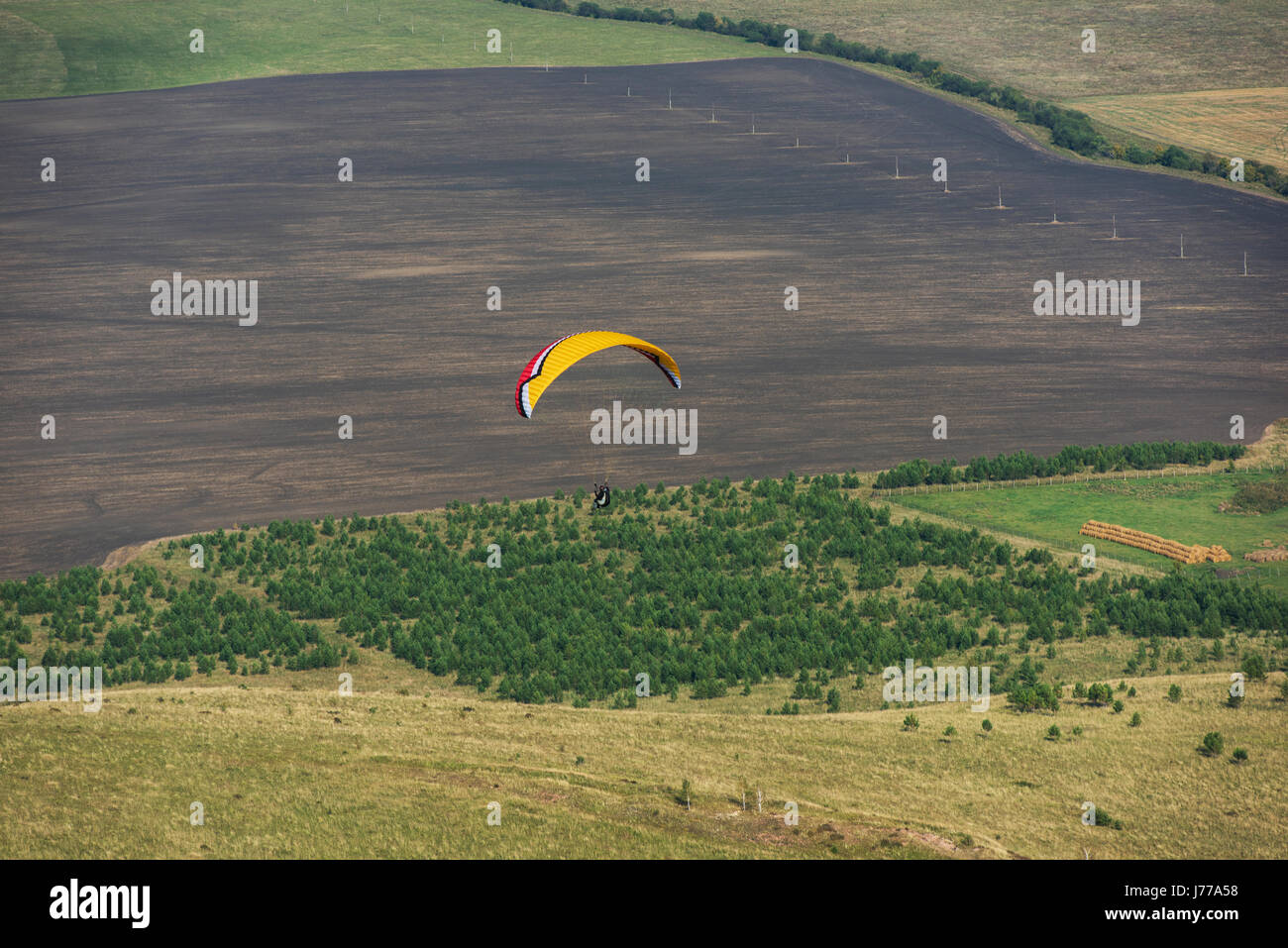 Paragliding in mountains Stock Photo