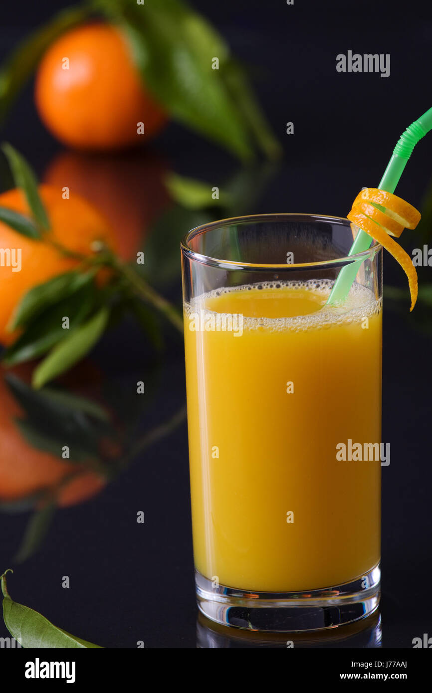orange juice juice oranges straw fruit juice orange peel glass chalice