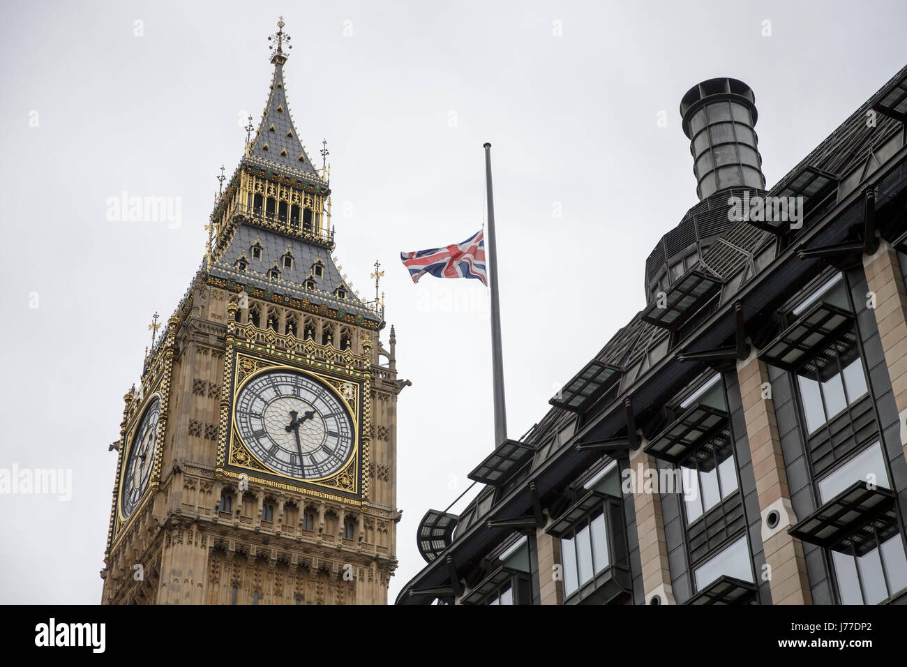 London, UK. 23rd May, 2017. Flag flies at half mast above Portcullis House next to the Houses of Parliament after Manchester Arena bombing, in London, UK, on May 23, 2017. Credit: Tim Ireland/Xinhua/Alamy Live News Stock Photo