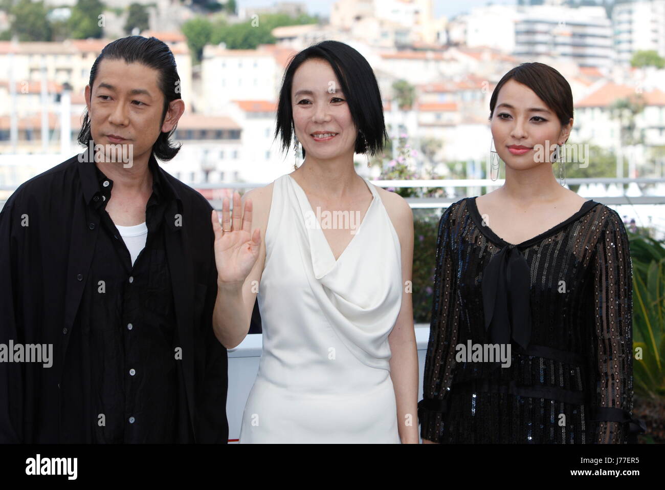 Cannes, France. 23rd May, 2017. Actors Masatoshi Nagase (L-R), Misuzu Kanno and Ayame Misaka pose at the photocall of the movie 'Radiance (Hikari)' during the 70th Annual Cannes Film Festival at Palais des Festivals in Cannes, France, on 23 May 2017. - NO WIRE SERVICE · Photo: Hubert Boesl/dpa/Alamy Live News Stock Photo