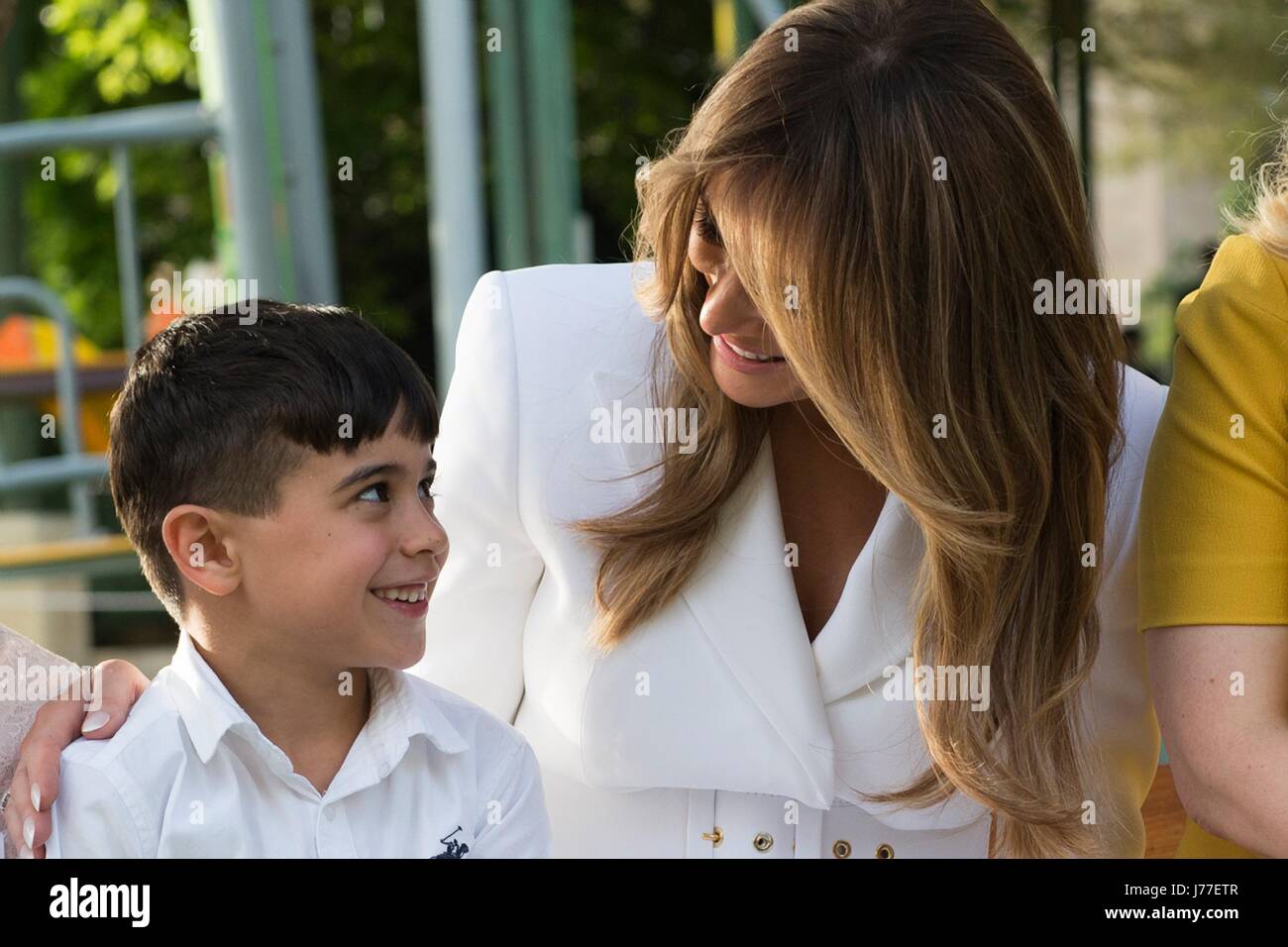 U.S. First Lady Melania Trump embraces a young child while visiting the Hadassah University Medical Center run by the Hadassah Women's Zionist Organization May 22, 2017 in Jerusalem, Israel. Stock Photo