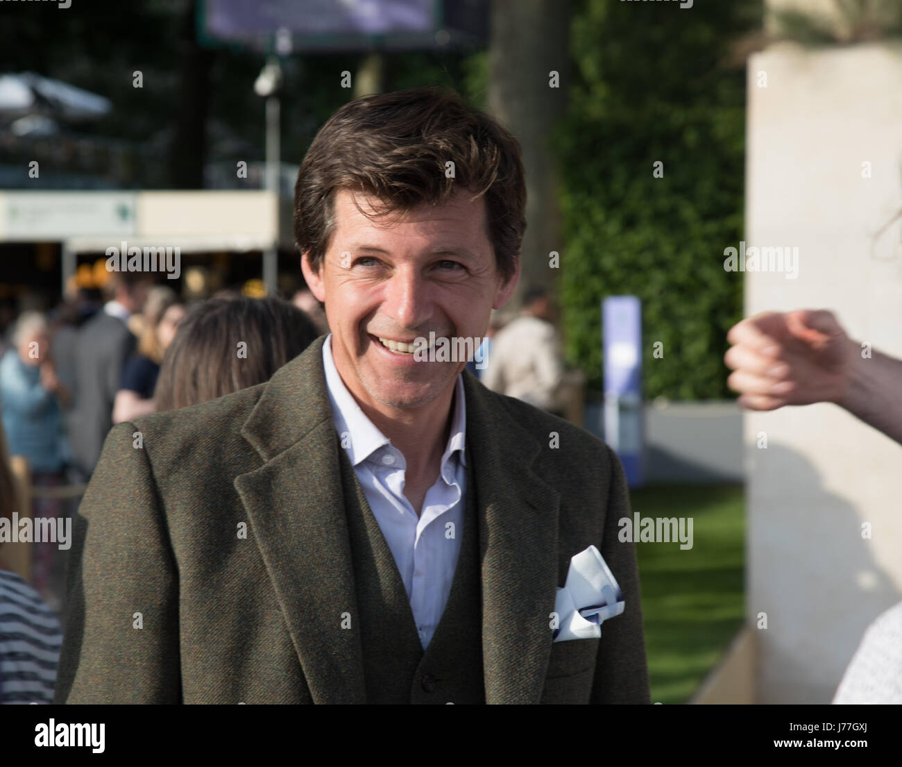 Chelsea, London, UK. 23rd May 2017. Garden designer James Basson talks happily to visitors following the announcement that his Show Garden at the Chelsea was awarded a prestigous gold medal and also named best in show. The show garden is designed to show how humans and nature interact on Malta. It takes elements of a disused quarry. The show garden was sponsored by M&G. Credit: WansfordPhoto/Alamy Live News Stock Photo