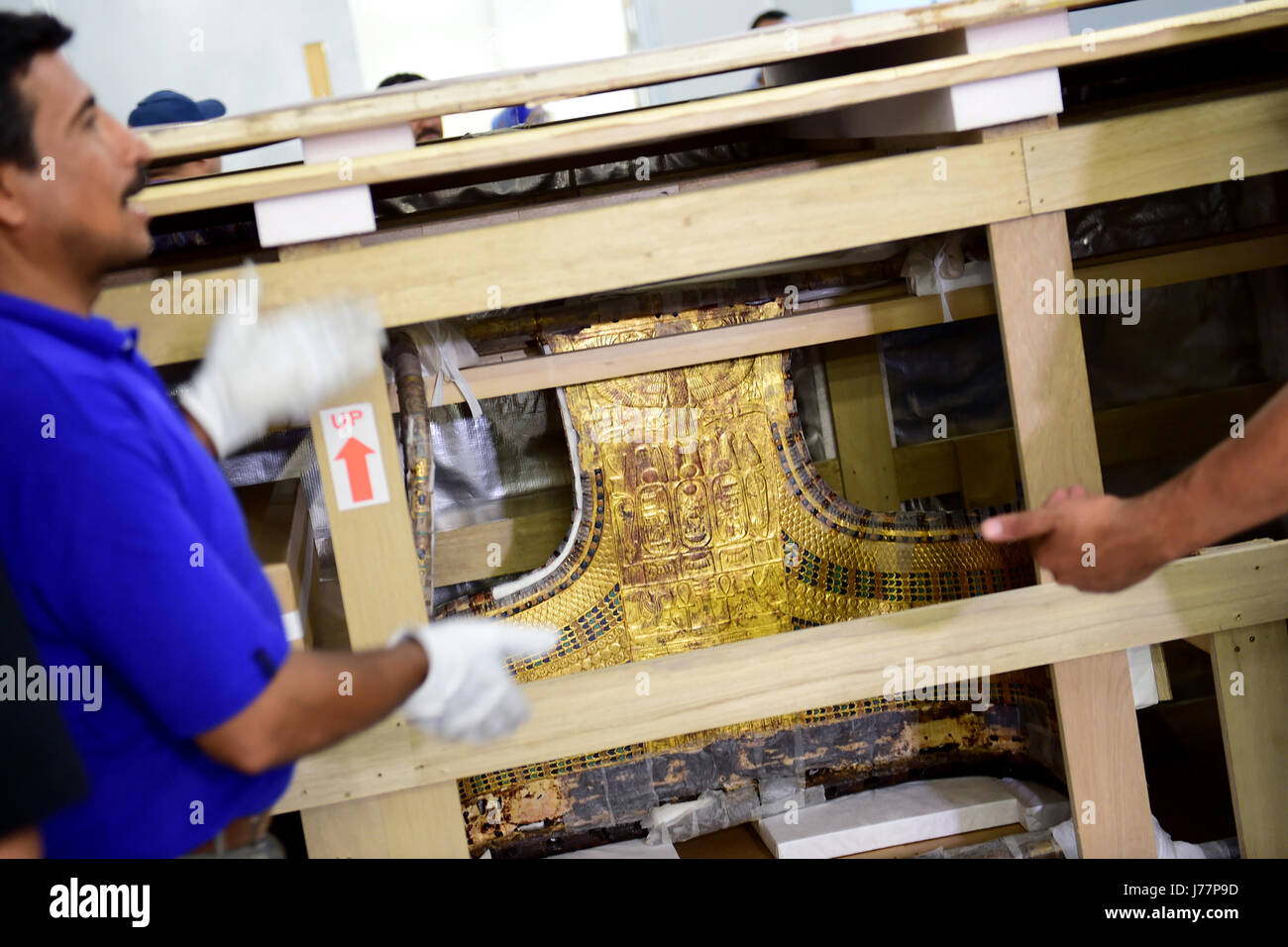 (170524) -- CAIRO, May 24, 2017 (Xinhua) -- A box containing the chariot of ancient King Tutankhamun is seen at the Grand Egyptian Museum (GEM) near the Pyramids Plateau in Giza, Egypt on May 23, 2017. The Egyptian Ministry of Antiquities moved on Tuesday the 3,000-year-old funerary bed and chariot of ancient King Tutankhamun from the Egyptian Museum in Tahrir downtown Cairo to the Grand Egyptian Museum (GEM) near the Pyramids Plateau in Giza. Egyptian Antiquities Minister Khaled al-Anany told reporters that they moved so far about 3,900 pieces of King Tut's artifact to the GEM that will be op Stock Photo